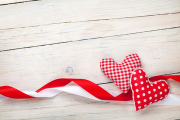 Obraz premium Valentines day background with hearts and ribbons