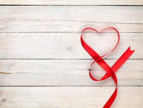 Valentines day background with heart shaped ribbon