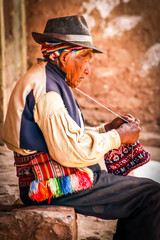 Old men knitting at taquile island in puno peru - obrazy, fototapety, plakaty