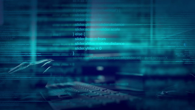 Abstract animated script programming code on desktop computer.