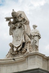 Fototapeta na wymiar Sculptures on the facade of Vatican city works