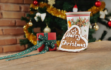 present and cookie with cinamon cup of tea for Christmas