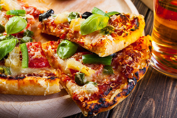 Pizza hawaii with beer