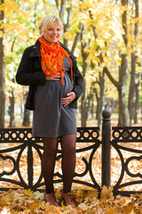 pregnant woman in autumn park