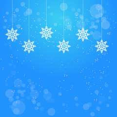 Naklejka na ściany i meble Christmas blue background with hanging snowflakes