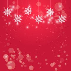 Christmas red background with hanging white snowflakes