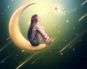 Obraz premium lonely thoughtful woman sitting on the crescent moon