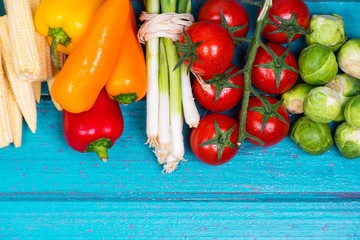 Fresh vegetables, with copy space on wood background