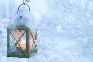 art Christmas lantern with snowfall
