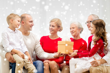 smiling family with gift at home