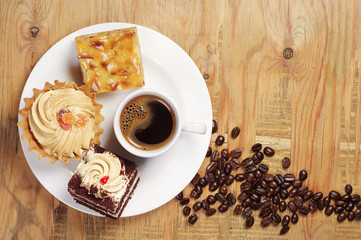 Plate with cakes and coffee