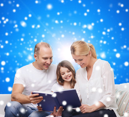 happy family with book at home