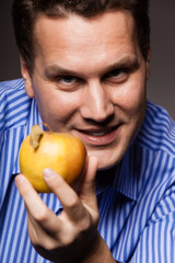 Diet nutrition. Happy man holding apple fruit