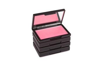 Pink blush on a pile of blush boxes isolated on white