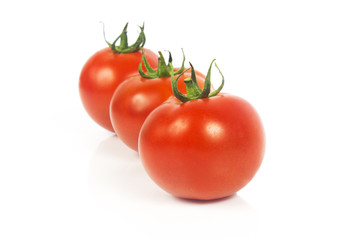 Fresh tomatoes isolated on white