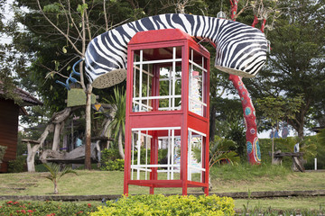 Fototapeta na wymiar fashioned telephone booth or public payphone