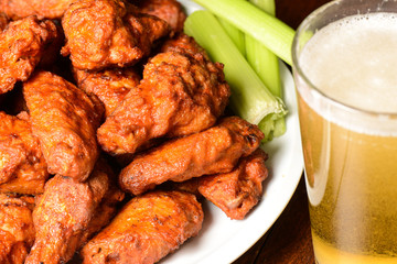 Buffalo Wings with Celery Sticks and Beer - 73699648