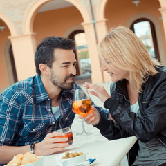 Couple drinking aperitif in a Bar