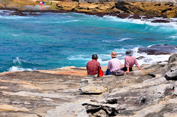 Friends hanging out at Tamarama Beach, Sydney