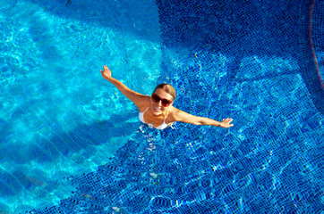 Beautiful woman in the pool.