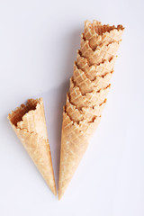 row of ice cream cones on white background