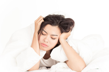 Portrait of a beautiful young woman in bed