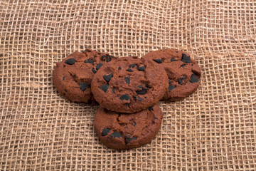 Chocolate chip cookies on burlap background
