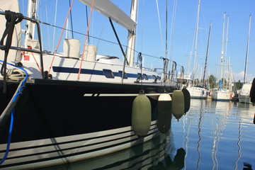 	 Blue sail boat yacht in marina