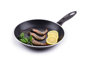 Raw shrimps on pan