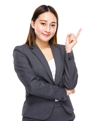 Asian businesswoman with finger point aside