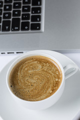 cup of coffee in a white cup on a white plate