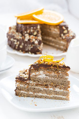 piece of cake with chocolate cream and nuts, vertical