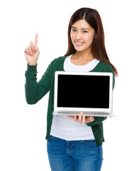 Woman show with blank screen of computer and finger point up