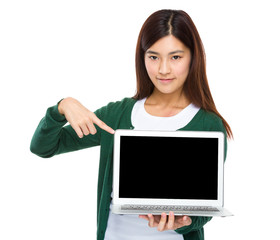 Woman finger point down to the blank screen of computer