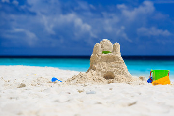 Sand castle on tropical beach