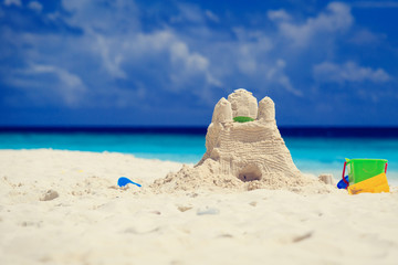 Fototapeta na wymiar Sand castle on tropical beach
