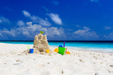 Sand castle on tropical beach