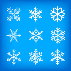 Fototapeta na wymiar white snowflakes on blue background
