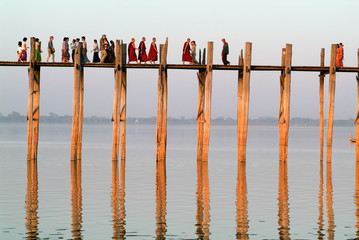 People walking on the wooden bridge of U Bein on river Ayeyarwad