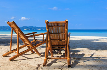 Two chairs on sand beach in Boracay, Philippines