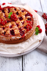 Tasty cake with berries on table close-up