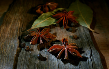 Star anise on dark wooden background, close-up