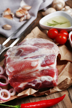 Raw meat on wooden table, close-up