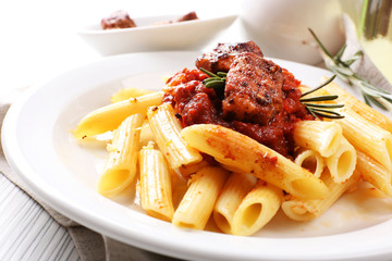 Tasty pasta with meat on table