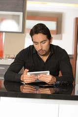 handsome modern young man using tablet