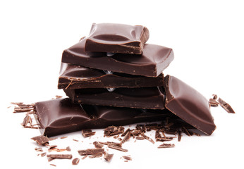 Dark chocolate bars stack with crumbs isolated on a white