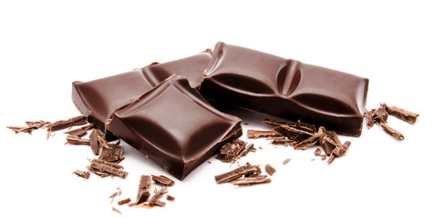Dark chocolate bars stack with crumbs isolated on a white