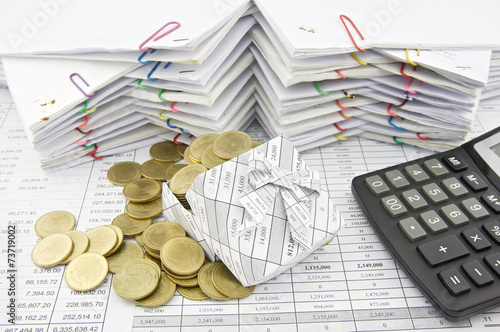Gold Coin Overload From Gift Box And Calculator Stock Photo Gold Coin Overload From Gift Box And Calculator
