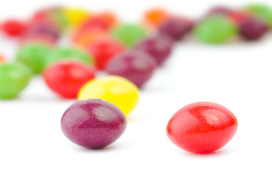 An assortment of colorful candy on white background