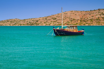 Fototapeta na wymiar Yacht on the blue lagoon of Crete, Greece